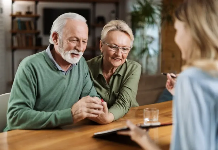 older couple speaking with professional about multi-class investment management