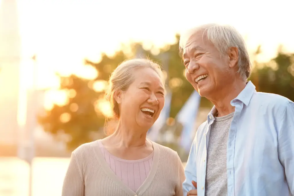 senior asian couple laughing and smiling together