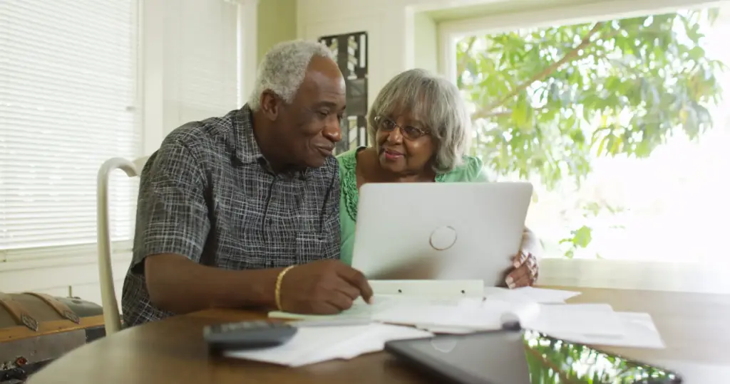 older couple looking at their finances together