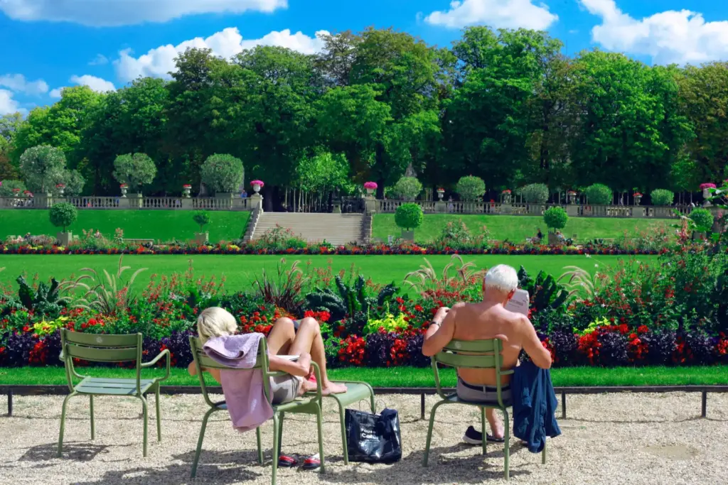 retired couple sunning in a beautifully landscaped backyard
