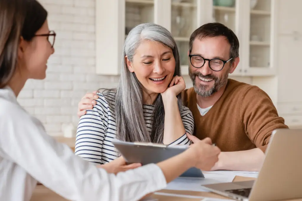 financial consultant discussing charitable trusts with an older couple