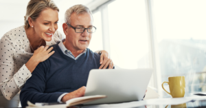 middle-aged couple looking at retirement planning services