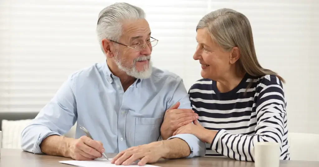 A retired married couple working on their will